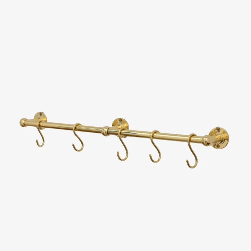 Brass wall-mounted rod with five S-shaped hooks and round mounting plates on white background.