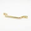 brass drawer pull handle with two screw holes and a gentle curve, shown on a white background.
