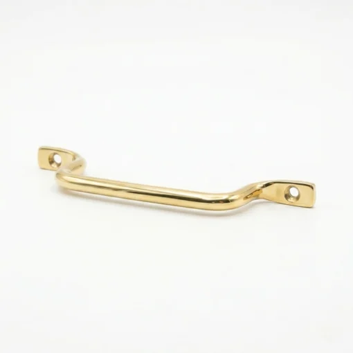 brass drawer pull handle with two screw holes and a gentle curve, shown on a white background.