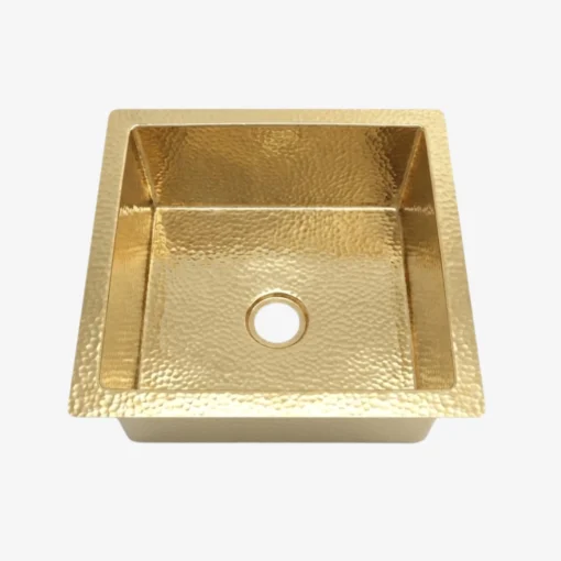 Square hammered brass single-basin sink with central drain hole and flat rim, shown top-down on a white background.